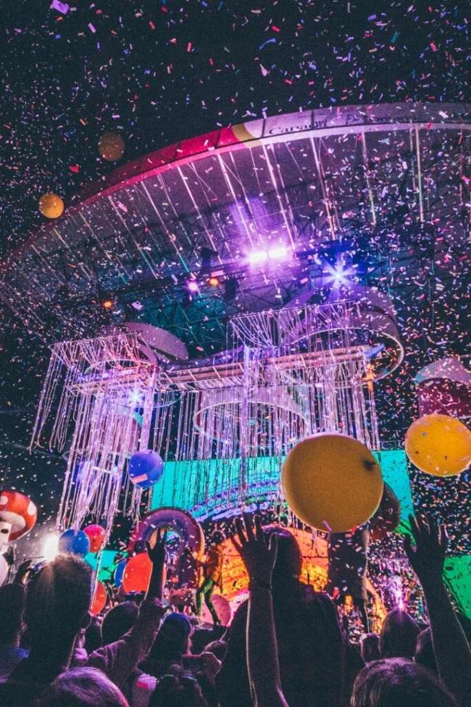 Outdoor event with spectacular light show in purple, blue and red